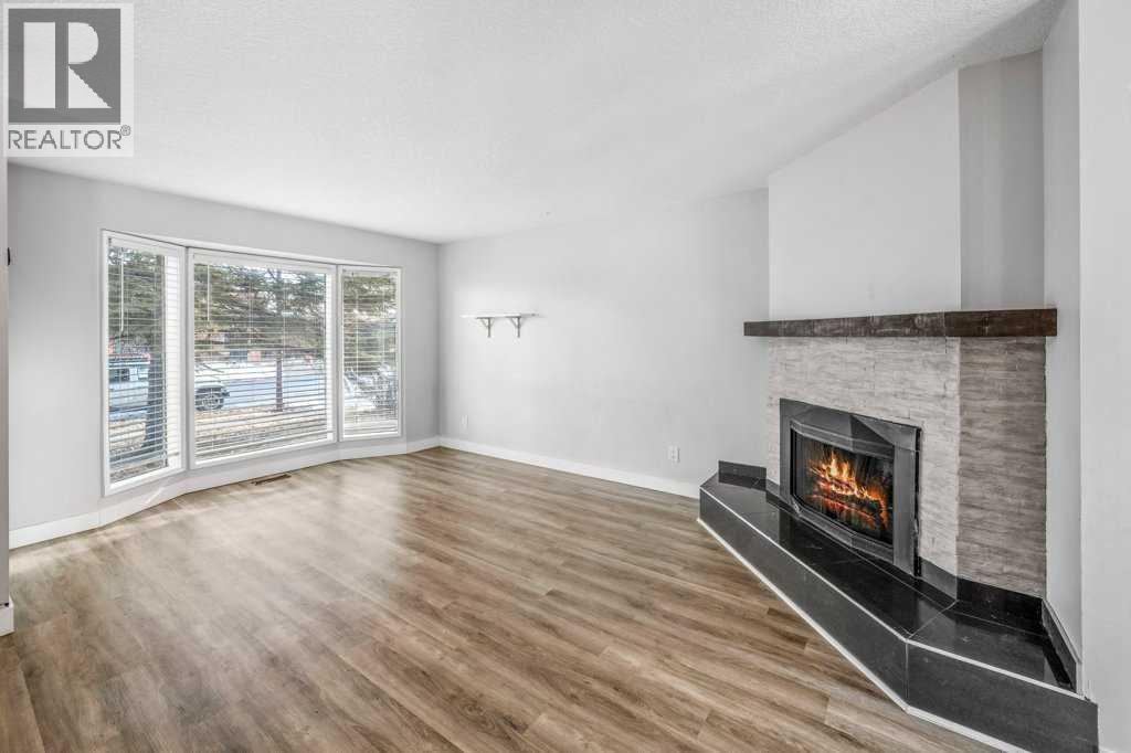 2140 146 Avenue Se, Calgary, AB - Indoor Photo Showing Living Room With Fireplace