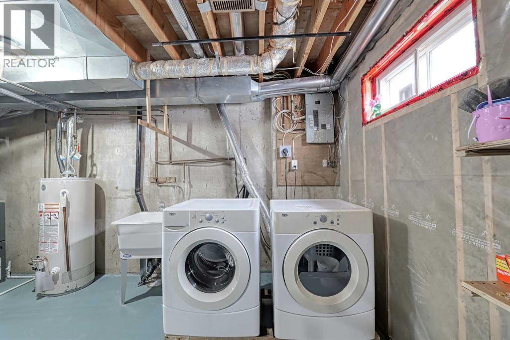 28 7 Avenue Se, High River, AB - Indoor Photo Showing Laundry Room