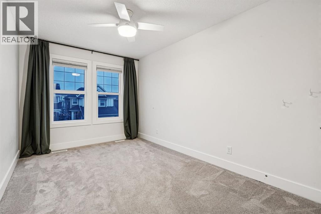 47 Sundown Way, Cochrane, AB - Indoor Photo Showing Other Room