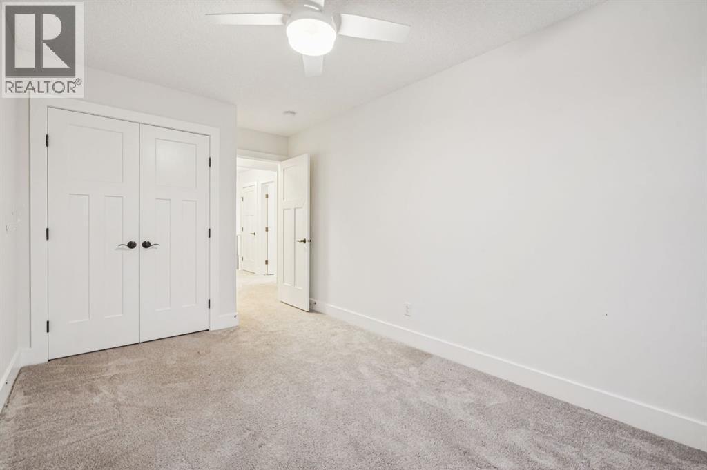 47 Sundown Way, Cochrane, AB - Indoor Photo Showing Other Room