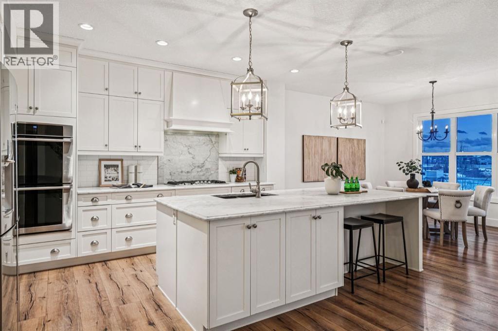 47 Sundown Way, Cochrane, AB - Indoor Photo Showing Kitchen With Upgraded Kitchen