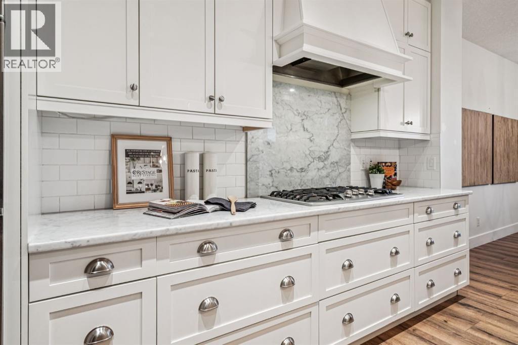 47 Sundown Way, Cochrane, AB - Indoor Photo Showing Kitchen With Upgraded Kitchen