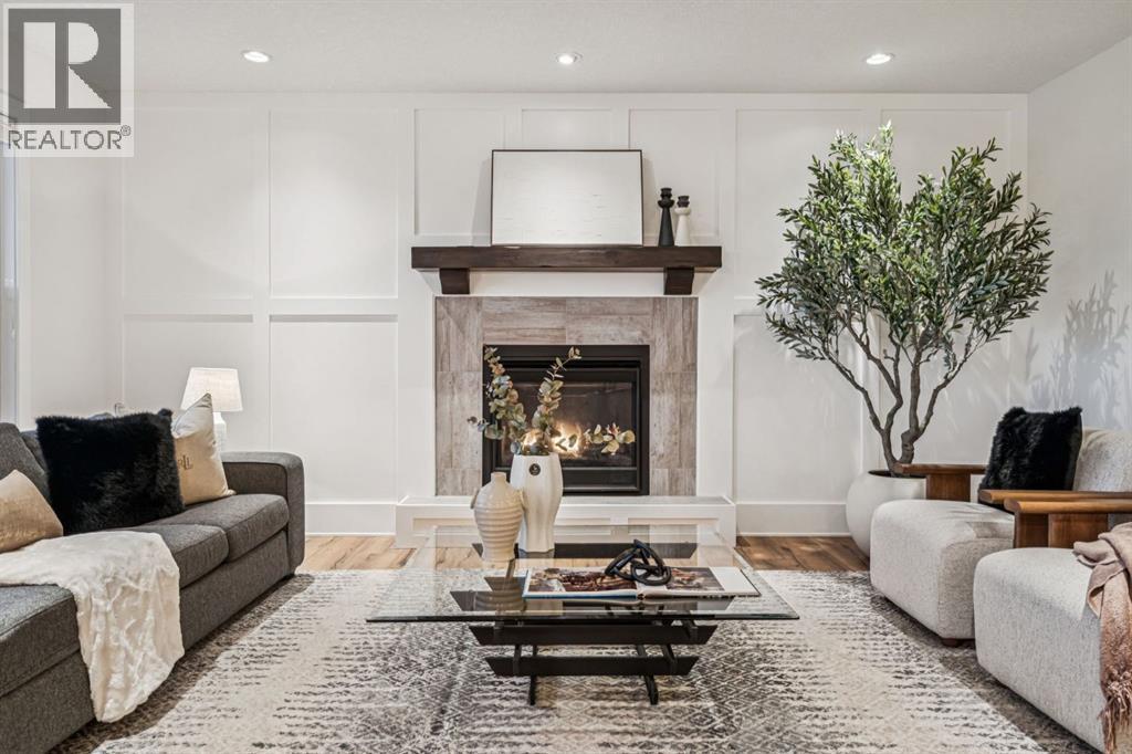 47 Sundown Way, Cochrane, AB - Indoor Photo Showing Living Room With Fireplace