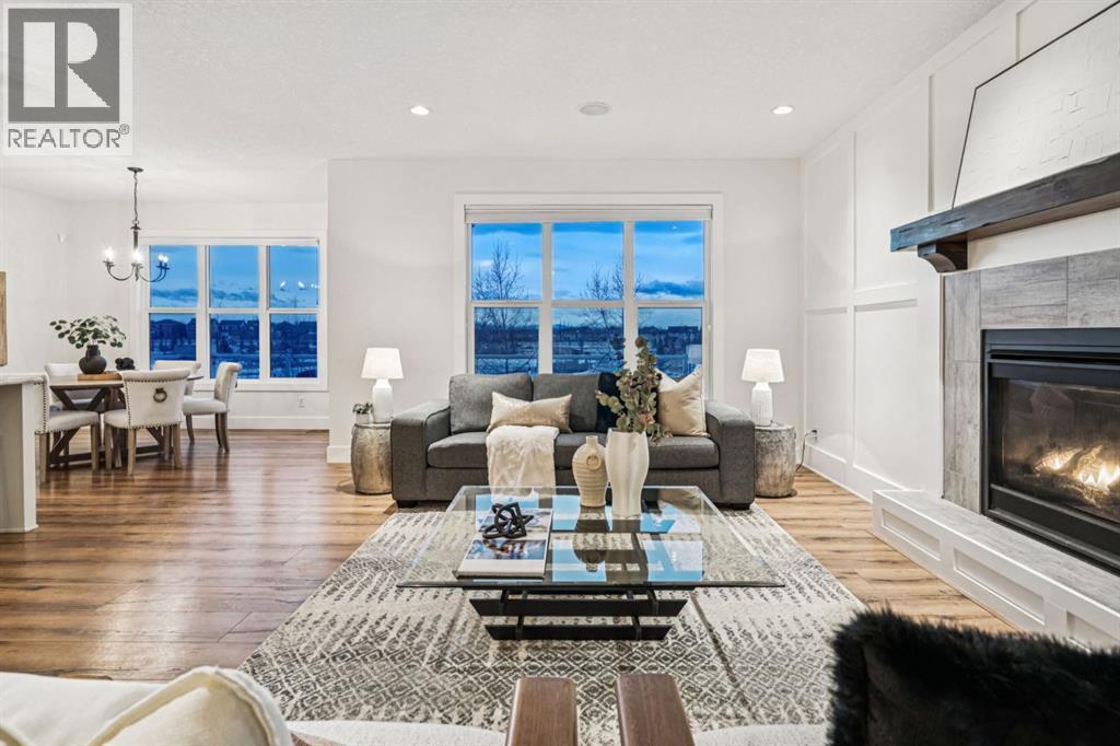 47 Sundown Way, Cochrane, AB - Indoor Photo Showing Living Room With Fireplace