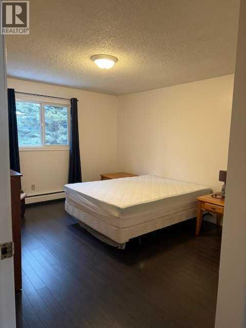 202, 11114 Hoppe, Grande Cache, AB - Indoor Photo Showing Bedroom
