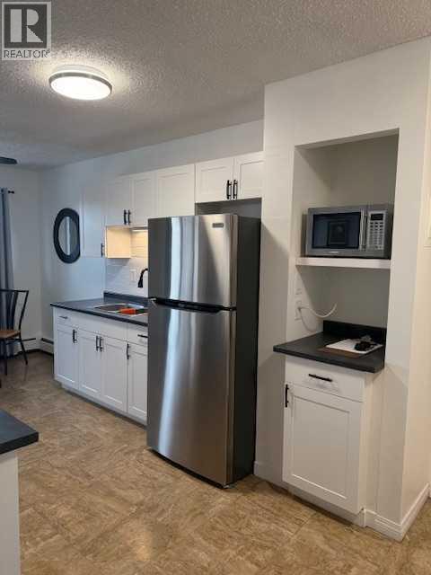 202, 11114 Hoppe, Grande Cache, AB - Indoor Photo Showing Kitchen