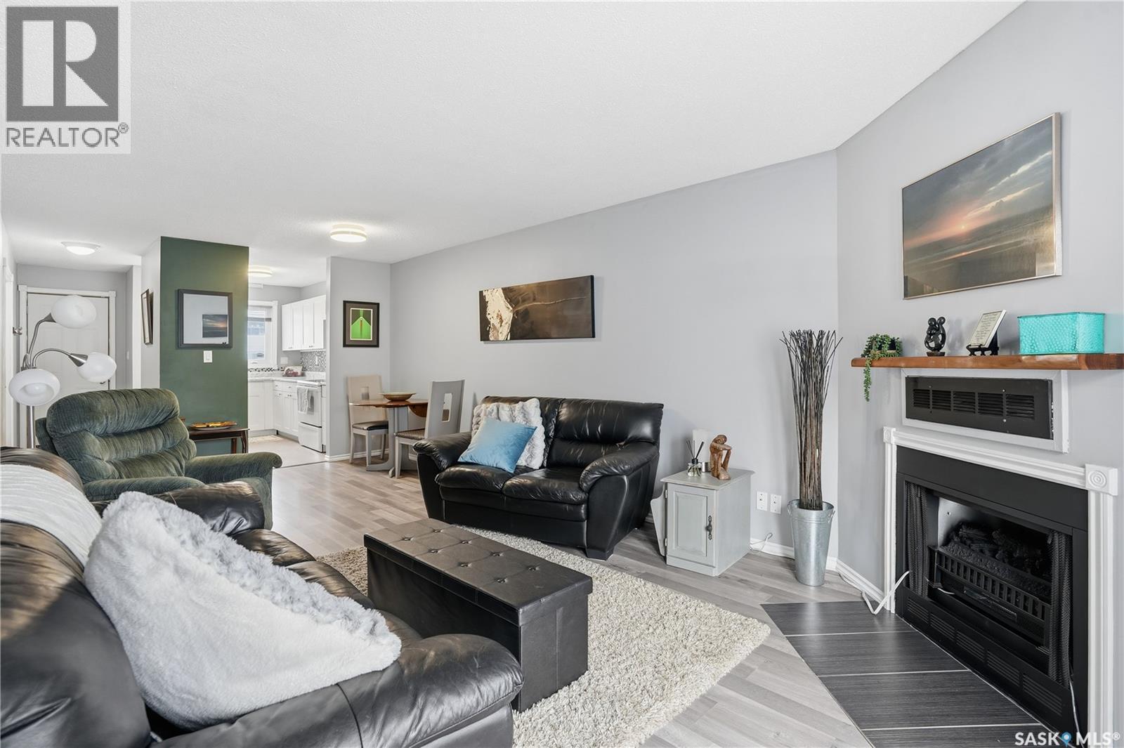 164 Cedar Meadow Drive, Regina, SK - Indoor Photo Showing Living Room With Fireplace