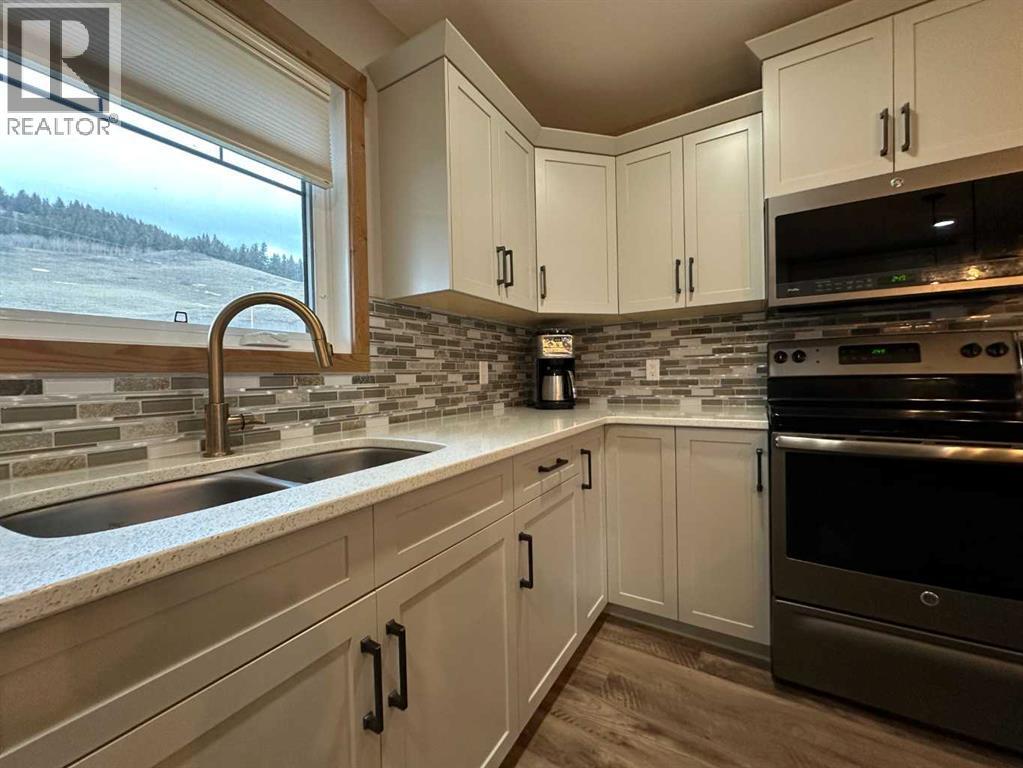 67 Ironstone Drive, Coleman, AB - Indoor Photo Showing Kitchen With Double Sink