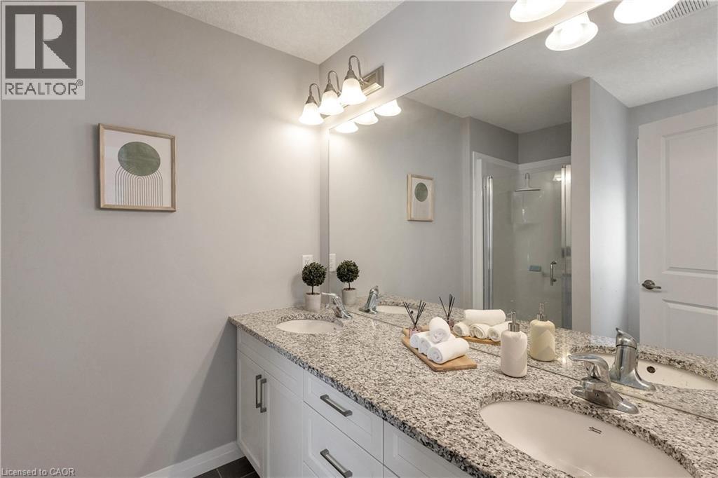 Full bath with a stall shower and double vanity - 492 Wismer Street, Waterloo, ON - Indoor Photo Showing Bathroom