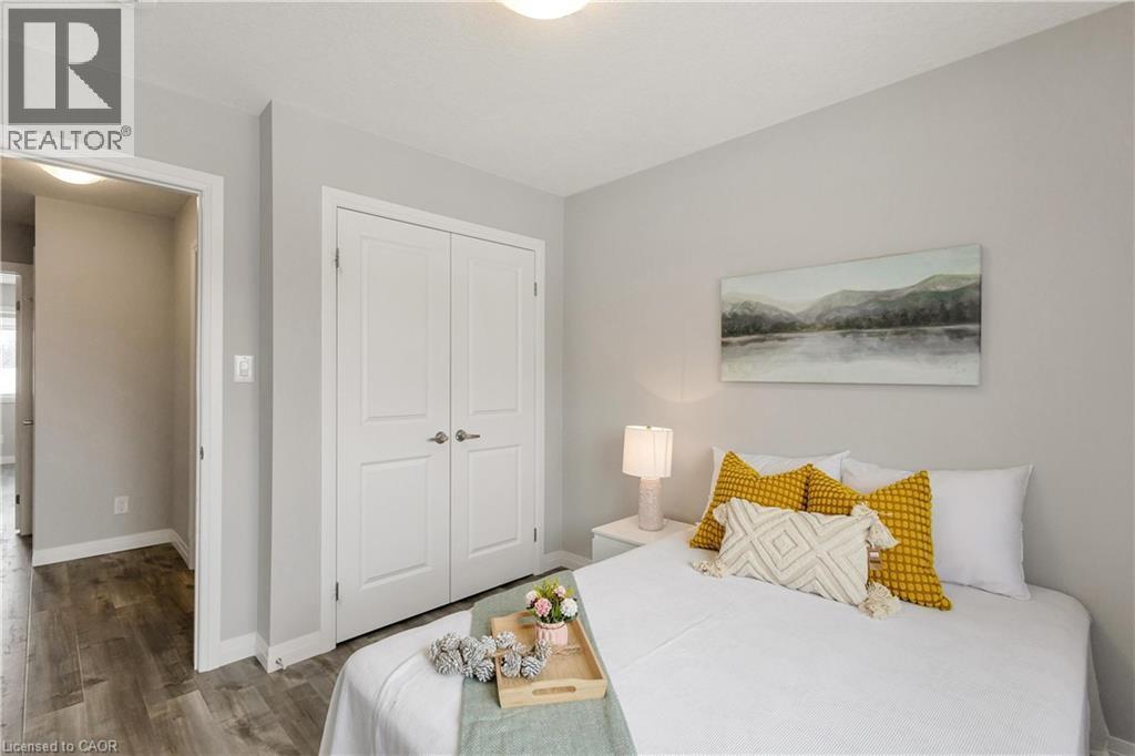 Bedroom with a closet and wood finished floors - 492 Wismer Street, Waterloo, ON - Indoor Photo Showing Bedroom
