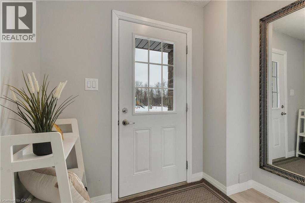 Doorway featuring baseboards and wood finished floors - 492 Wismer Street, Waterloo, ON - Indoor Photo Showing Other Room