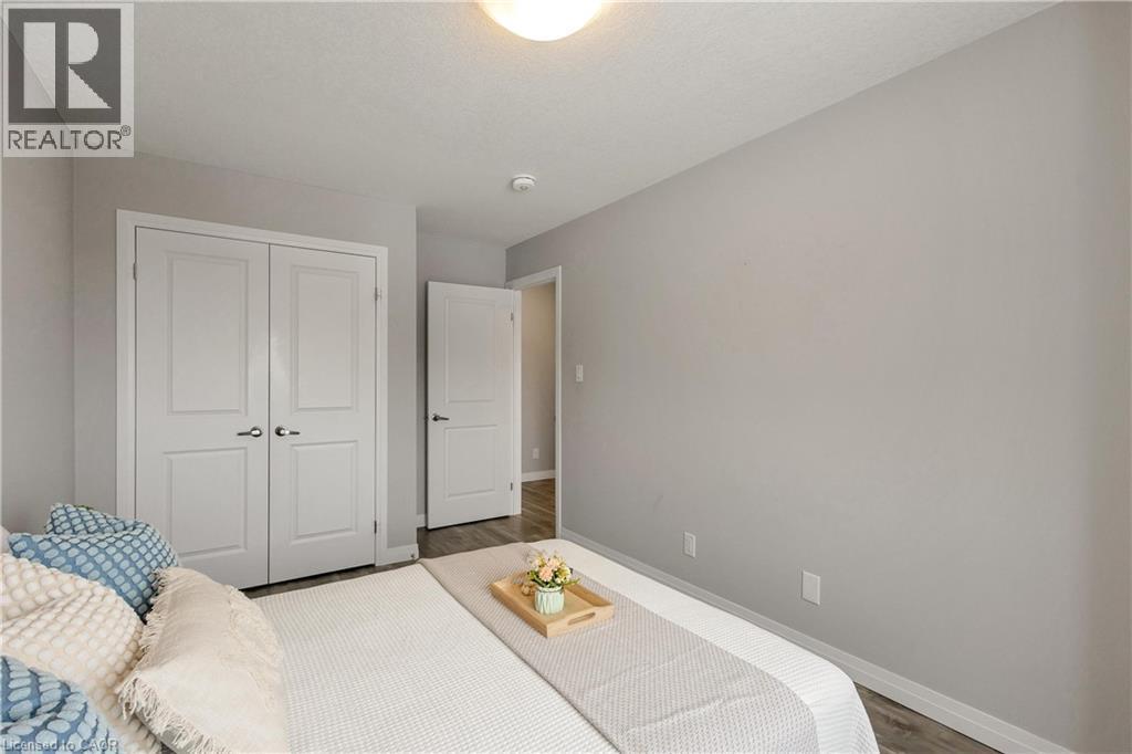 Bedroom with a closet and wood finished floors - 492 Wismer Street, Waterloo, ON - Indoor Photo Showing Bedroom