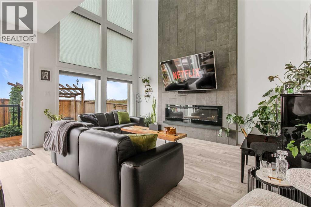 668 Aquitania Boulevard W, Lethbridge, AB - Indoor Photo Showing Living Room With Fireplace