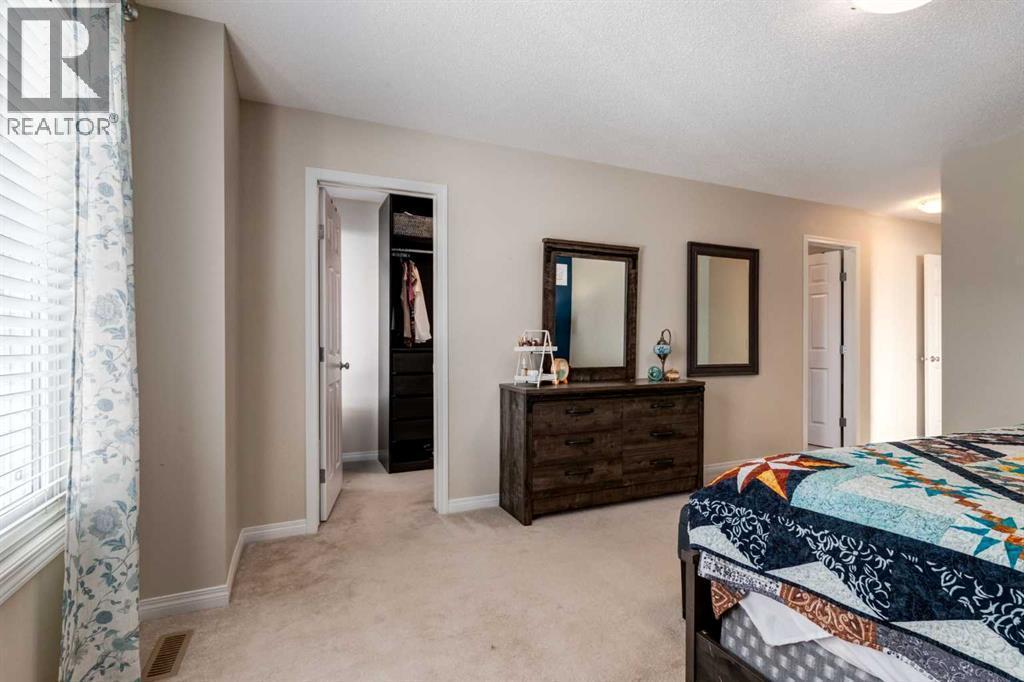 26 Mount Rae Terrace, Okotoks, AB - Indoor Photo Showing Bedroom