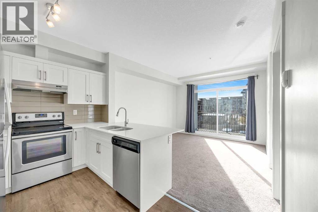 211, 10 Walgrove Walk Se, Calgary, AB - Indoor Photo Showing Kitchen With Stainless Steel Kitchen