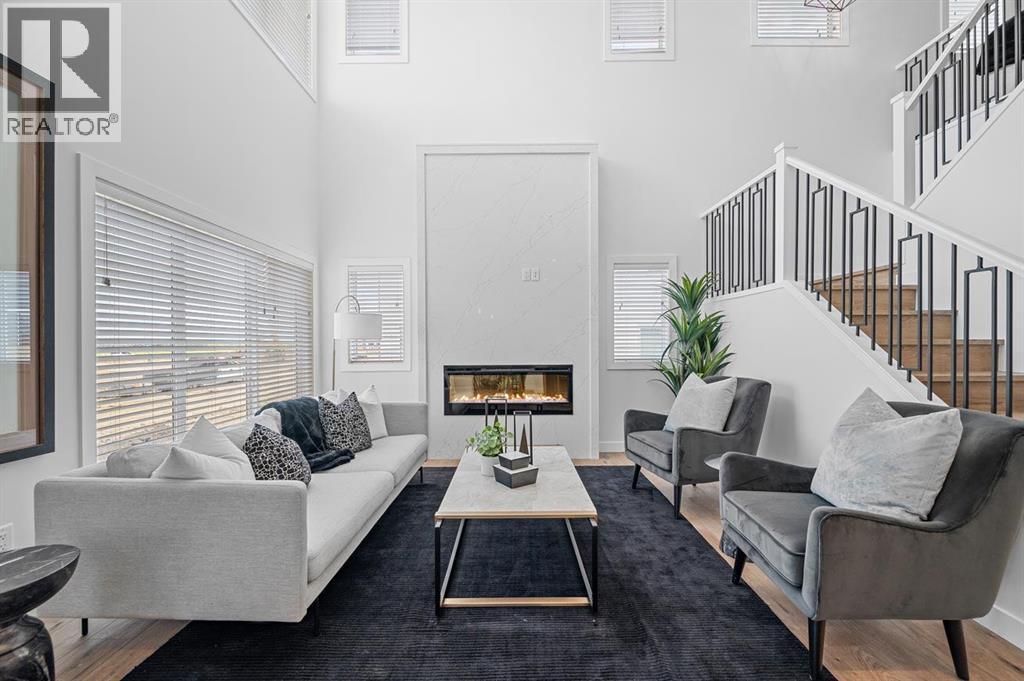 568 Walgrove Boulevard Se, Calgary, AB - Indoor Photo Showing Living Room With Fireplace