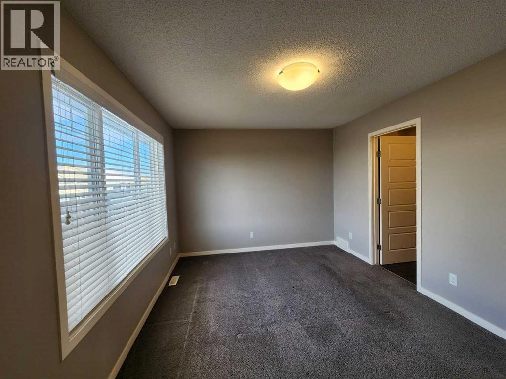 217 Panatella Walk Nw, Calgary, AB - Indoor Photo Showing Other Room