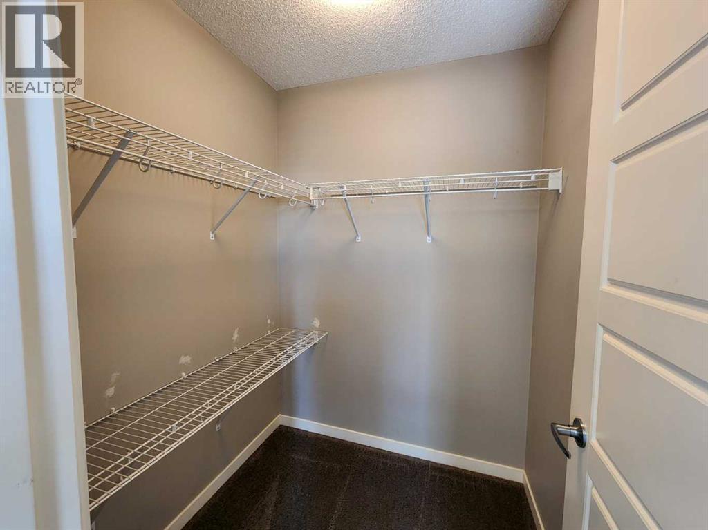 217 Panatella Walk Nw, Calgary, AB - Indoor With Storage