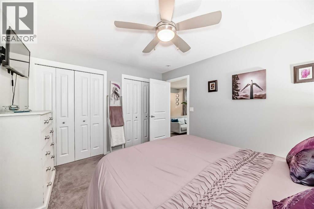 325 Sundown View, Cochrane, AB - Indoor Photo Showing Bedroom