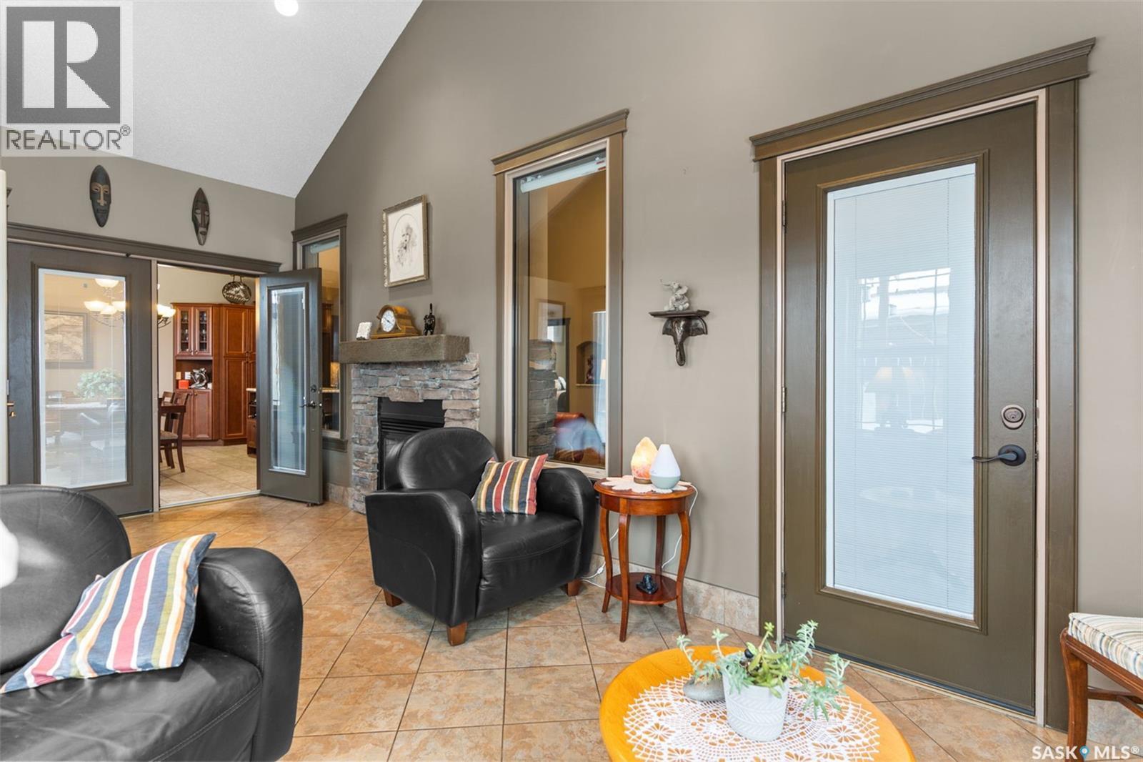 11 Robertson Road, Lanigan, SK - Indoor Photo Showing Living Room With Fireplace