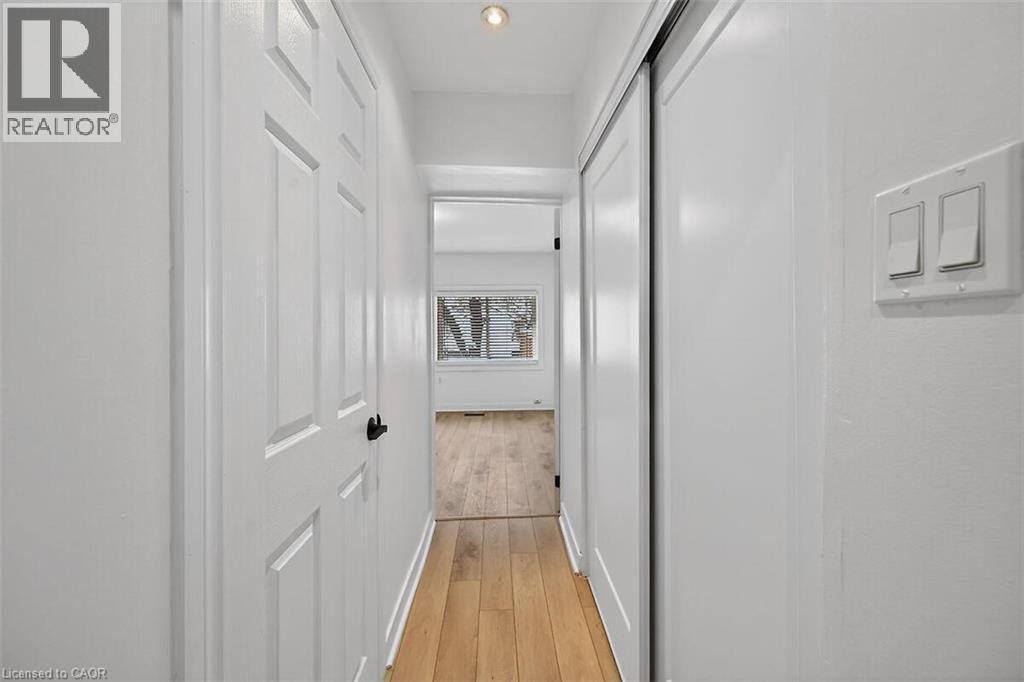 Hall with light wood finished floors - 77 Barton Street E Unit# 1, Hamilton, ON - Indoor Photo Showing Other Room