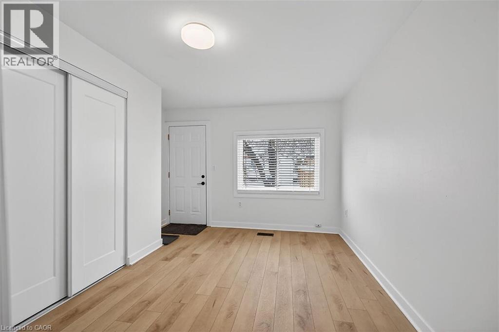 2nd Bedroom with access to the backyard - 77 Barton Street E Unit# 1, Hamilton, ON - Indoor Photo Showing Other Room