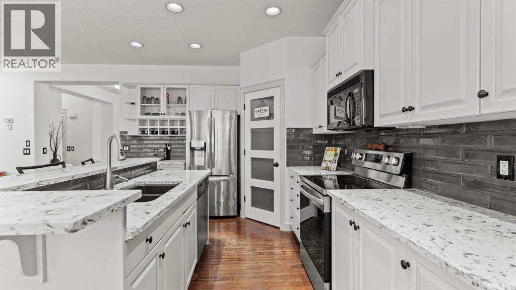 27 Cranwell Close Se, Calgary, AB - Indoor Photo Showing Kitchen With Stainless Steel Kitchen With Upgraded Kitchen