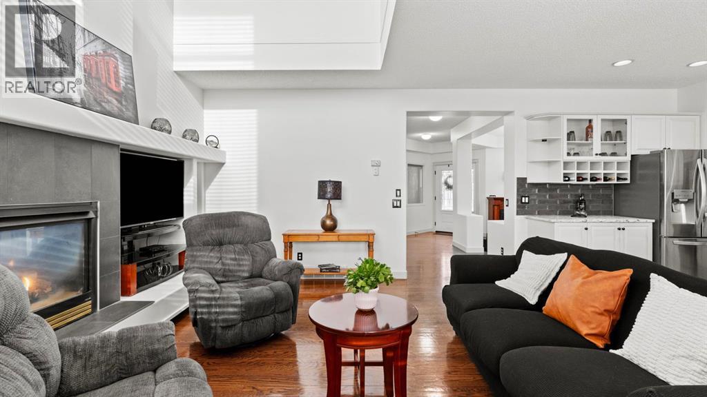 27 Cranwell Close Se, Calgary, AB - Indoor Photo Showing Living Room With Fireplace