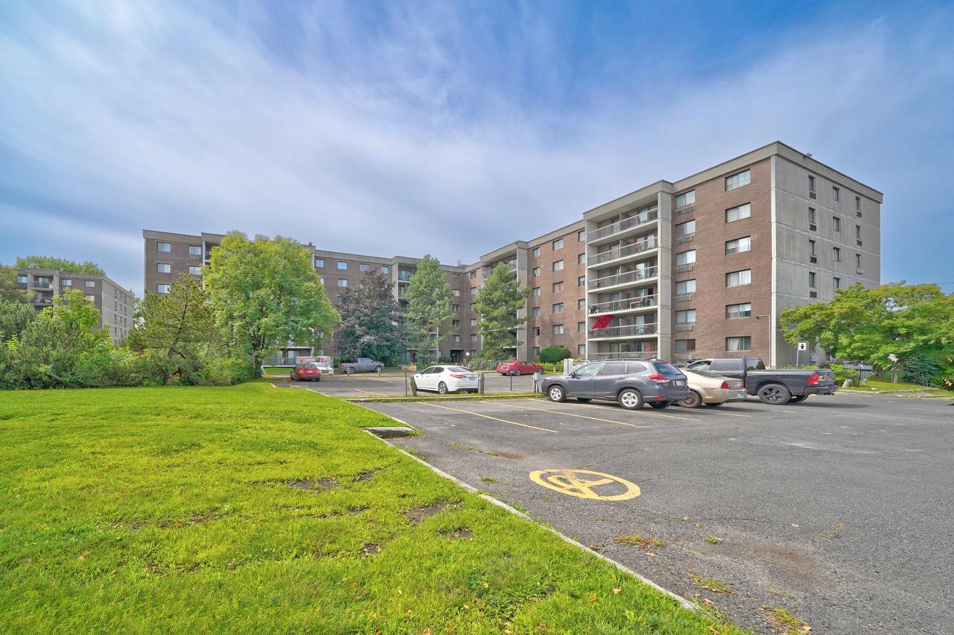 Stationnement - 309-1550 Av. Panama, Brossard, QC - Outdoor With Facade