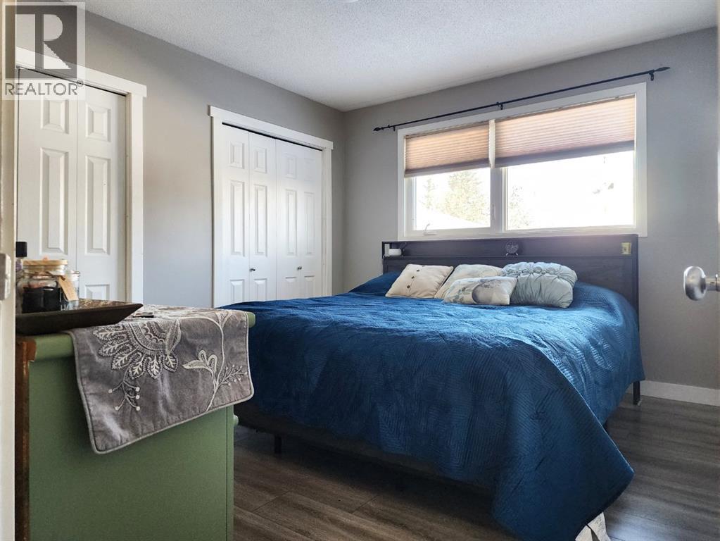 214 48 Avenue E, Claresholm, AB - Indoor Photo Showing Bedroom
