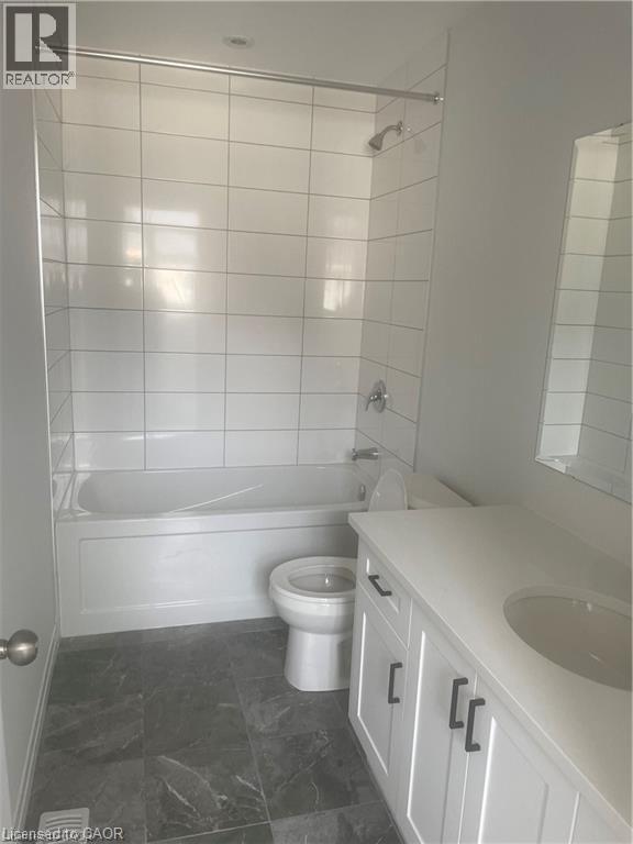 Full bath featuring vanity and washtub / shower combination - 152 Queensbrook Crescent, Cambridge, ON - Indoor Photo Showing Bathroom