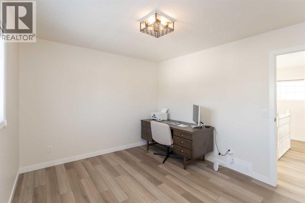 Upstairs middle bedroom - 10 Pickwick Lane, Lacombe, AB - Indoor Photo Showing Office
