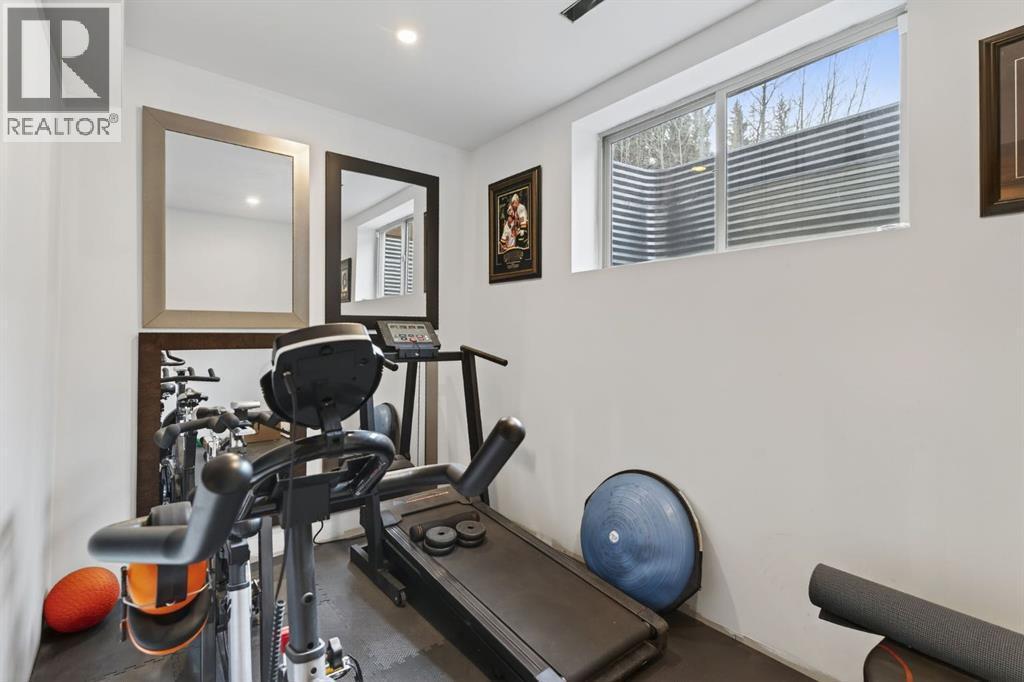 105 Riviera Crescent, Cochrane, AB - Indoor Photo Showing Gym Room