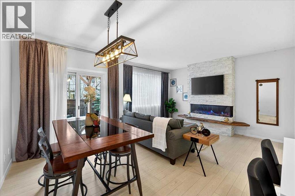 43 Chaparral Valley Common Se, Calgary, AB - Indoor Photo Showing Dining Room With Fireplace