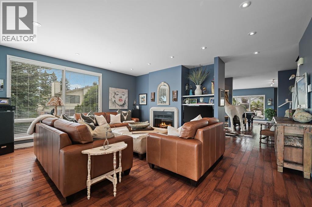 103 Stratton Park Sw, Calgary, AB - Indoor Photo Showing Living Room With Fireplace