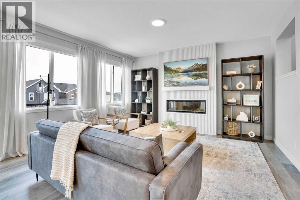 86 Edith Row Nw, Calgary, AB - Indoor Photo Showing Living Room With Fireplace