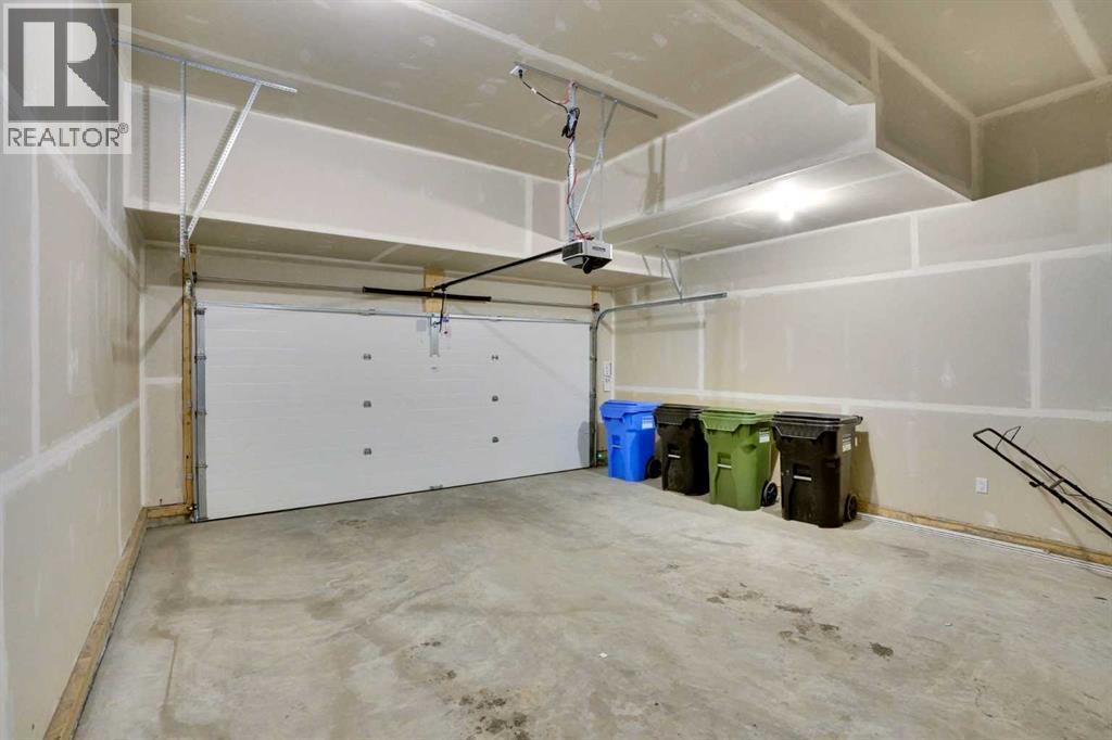 86 Edith Row Nw, Calgary, AB - Indoor Photo Showing Garage