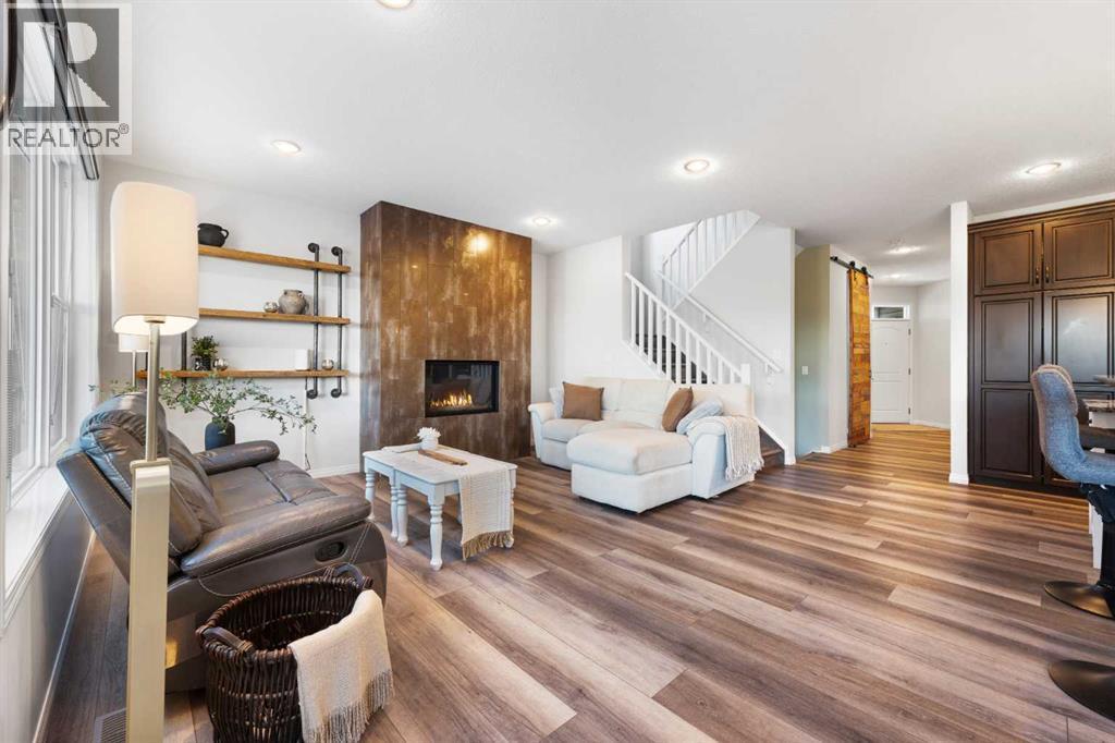 128 Auburn Bay Avenue Se, Calgary, AB - Indoor Photo Showing Living Room With Fireplace