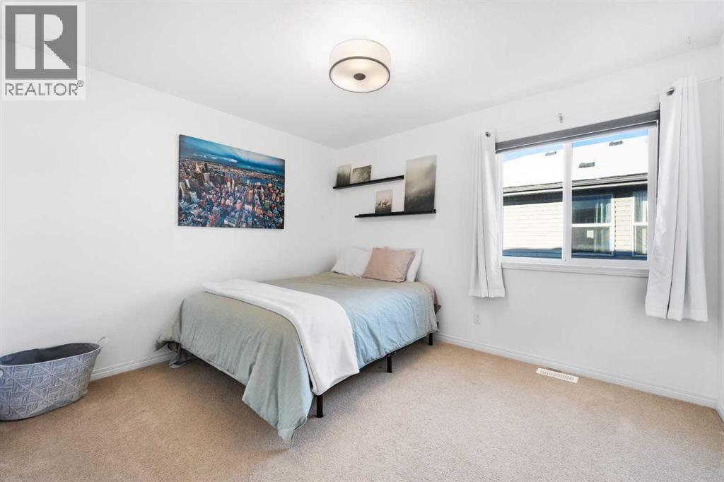 128 Auburn Bay Avenue Se, Calgary, AB - Indoor Photo Showing Bedroom