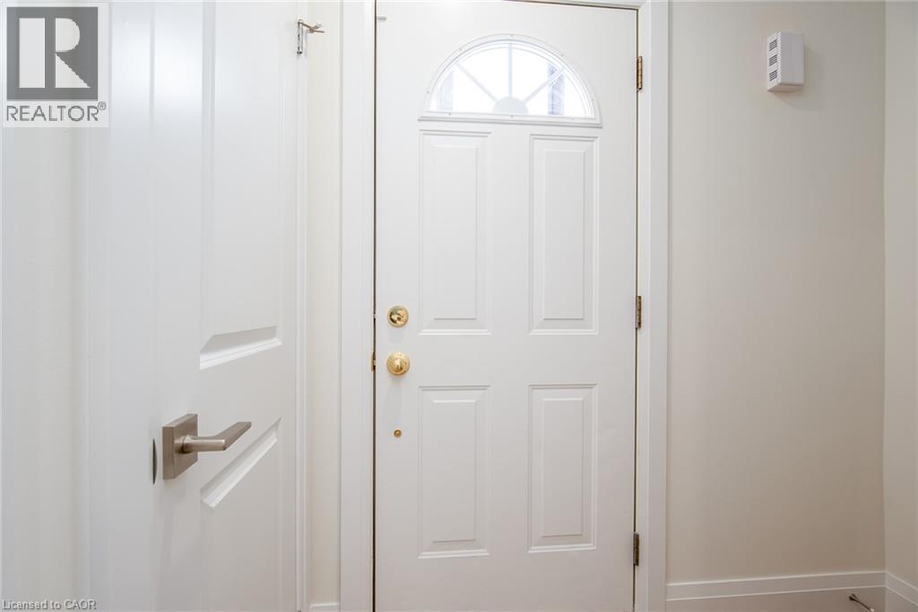 Doorway with baseboards - 27 Queenston Drive, Kitchener, ON - Indoor Photo Showing Other Room
