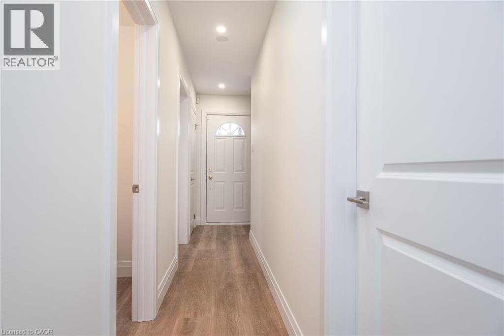 Corridor featuring light wood-style flooring and recessed lighting - 27 Queenston Drive, Kitchener, ON - Indoor Photo Showing Other Room