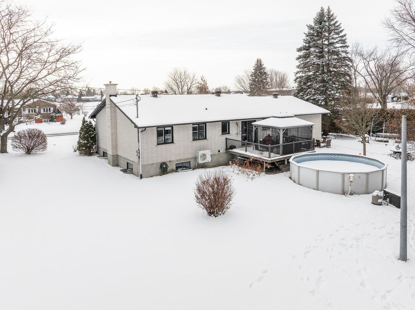 Back facade - 225 Rue Dupont, Saint-Jean-Sur-Richelieu, QC - Outdoor With Above Ground Pool