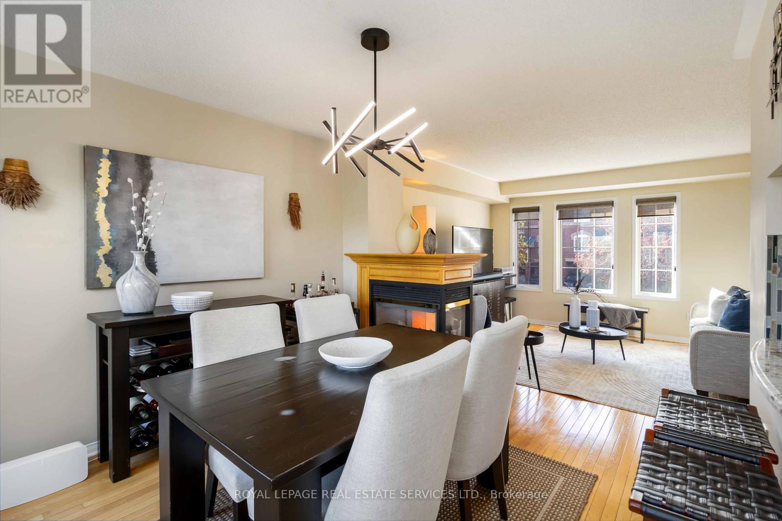 1584 Woodhenge Way, Mississauga, ON - Indoor Photo Showing Dining Room With Fireplace