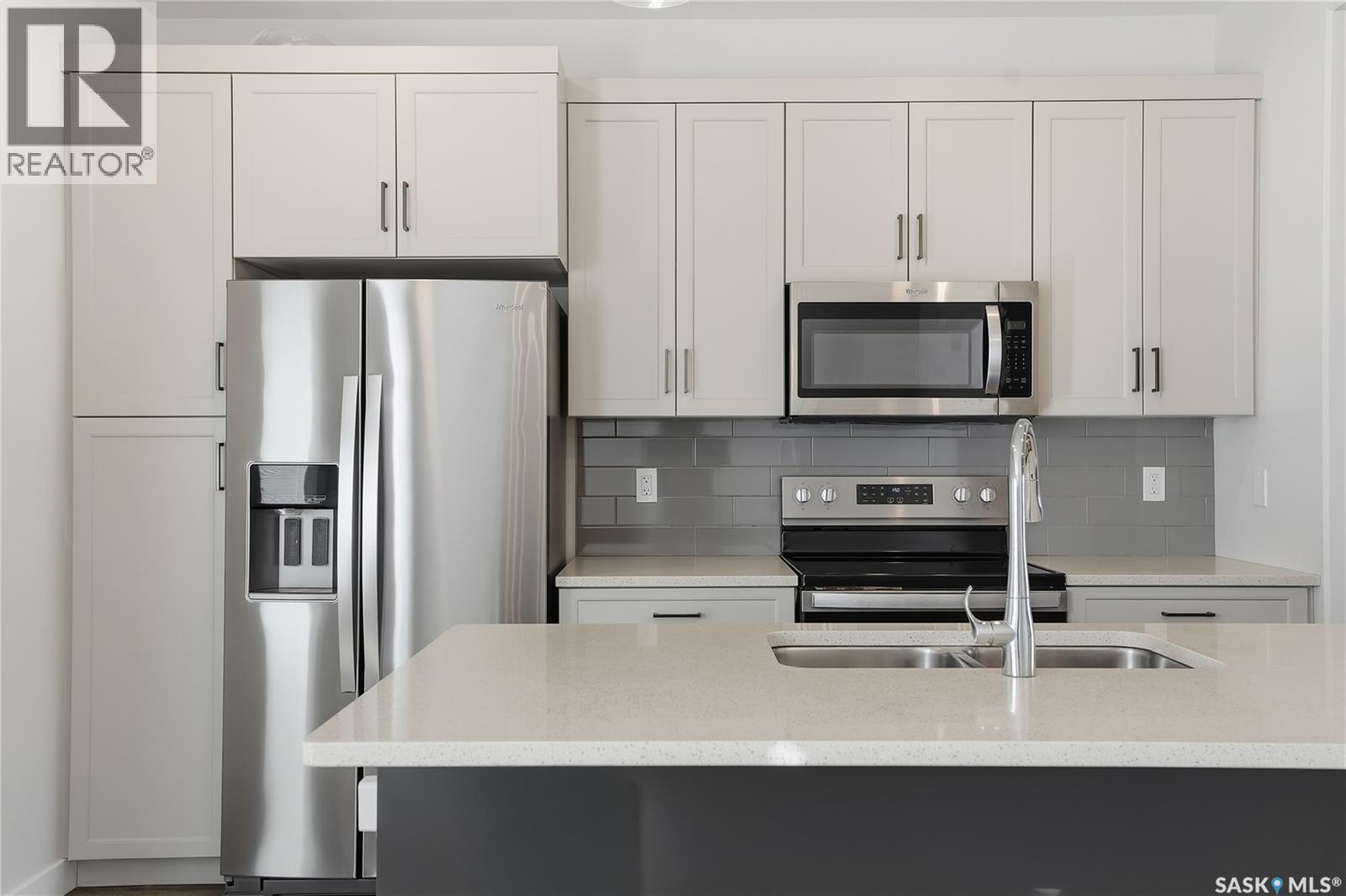 966 Mcfaull Manor, Saskatoon, SK - Indoor Photo Showing Kitchen With Double Sink With Upgraded Kitchen