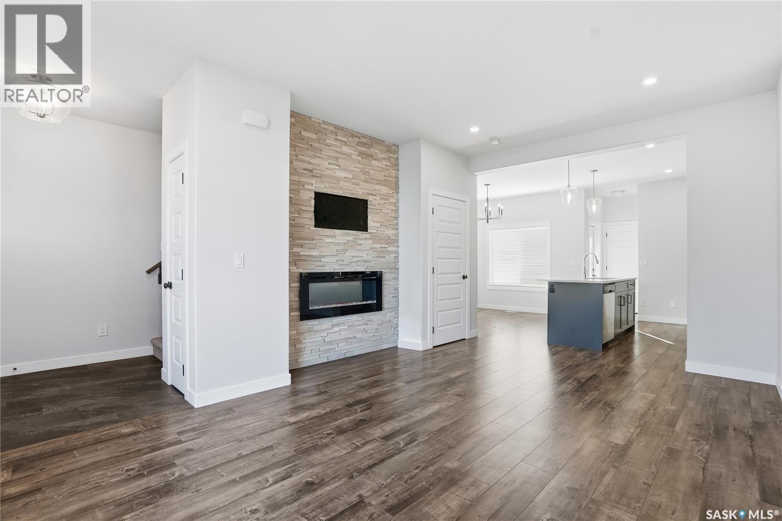 966 Mcfaull Manor, Saskatoon, SK - Indoor Photo Showing Living Room With Fireplace