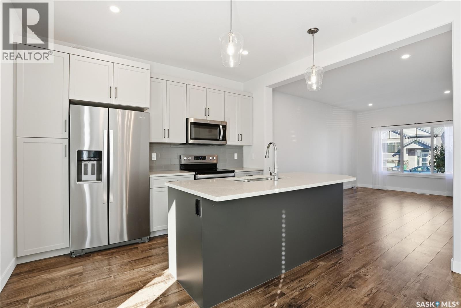 966 Mcfaull Manor, Saskatoon, SK - Indoor Photo Showing Kitchen With Double Sink With Upgraded Kitchen