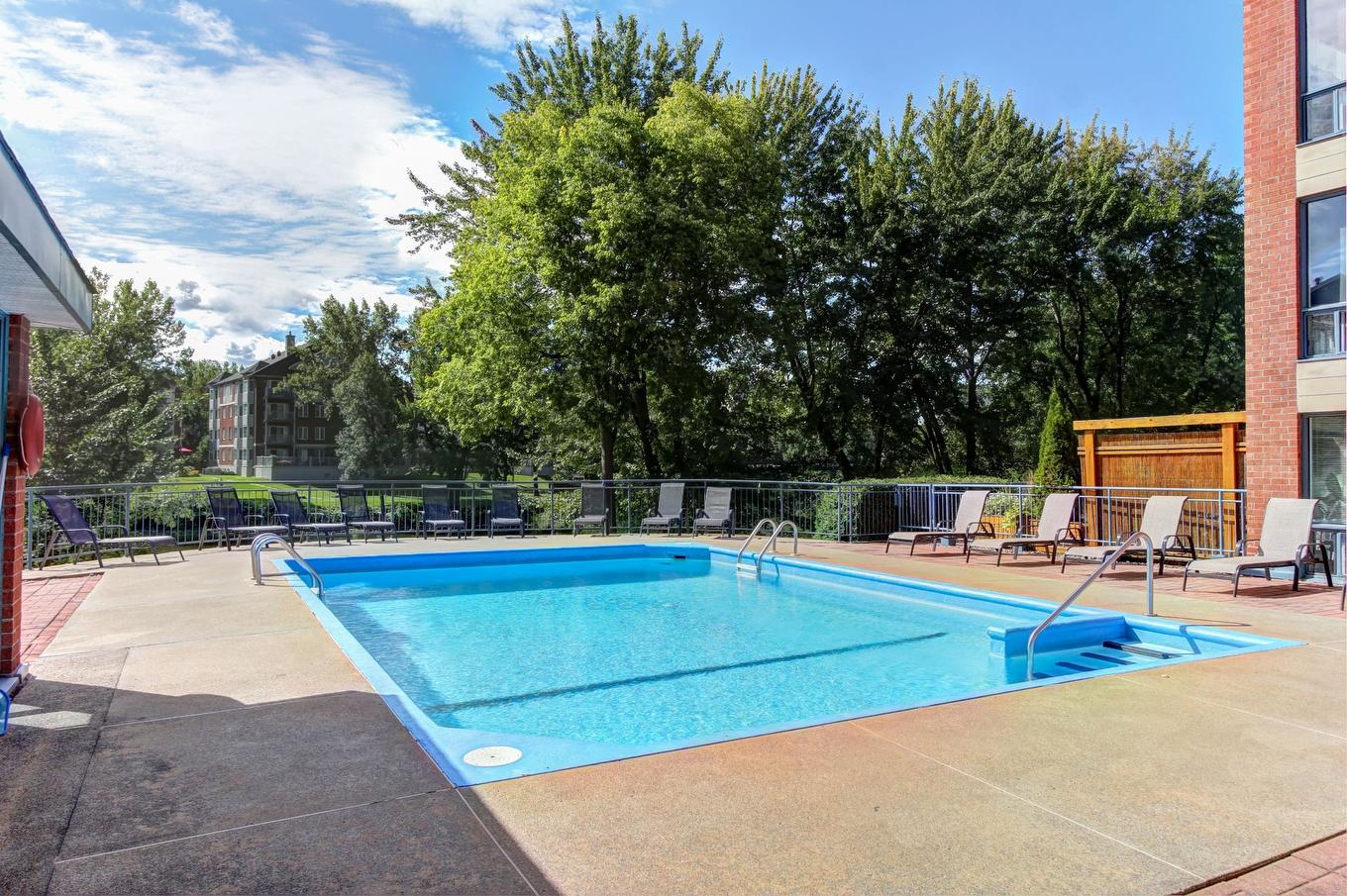 Pool - 506-4460 Ch. Des Cageux, Laval (Chomedey), QC - Outdoor With In Ground Pool With Backyard