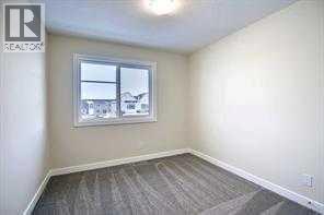 bedroom - 253 Cobblestone Gate Sw, Airdrie, AB - Indoor Photo Showing Other Room
