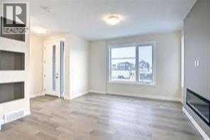 greatroom, fireplace optional - 253 Cobblestone Gate Sw, Airdrie, AB - Indoor With Fireplace