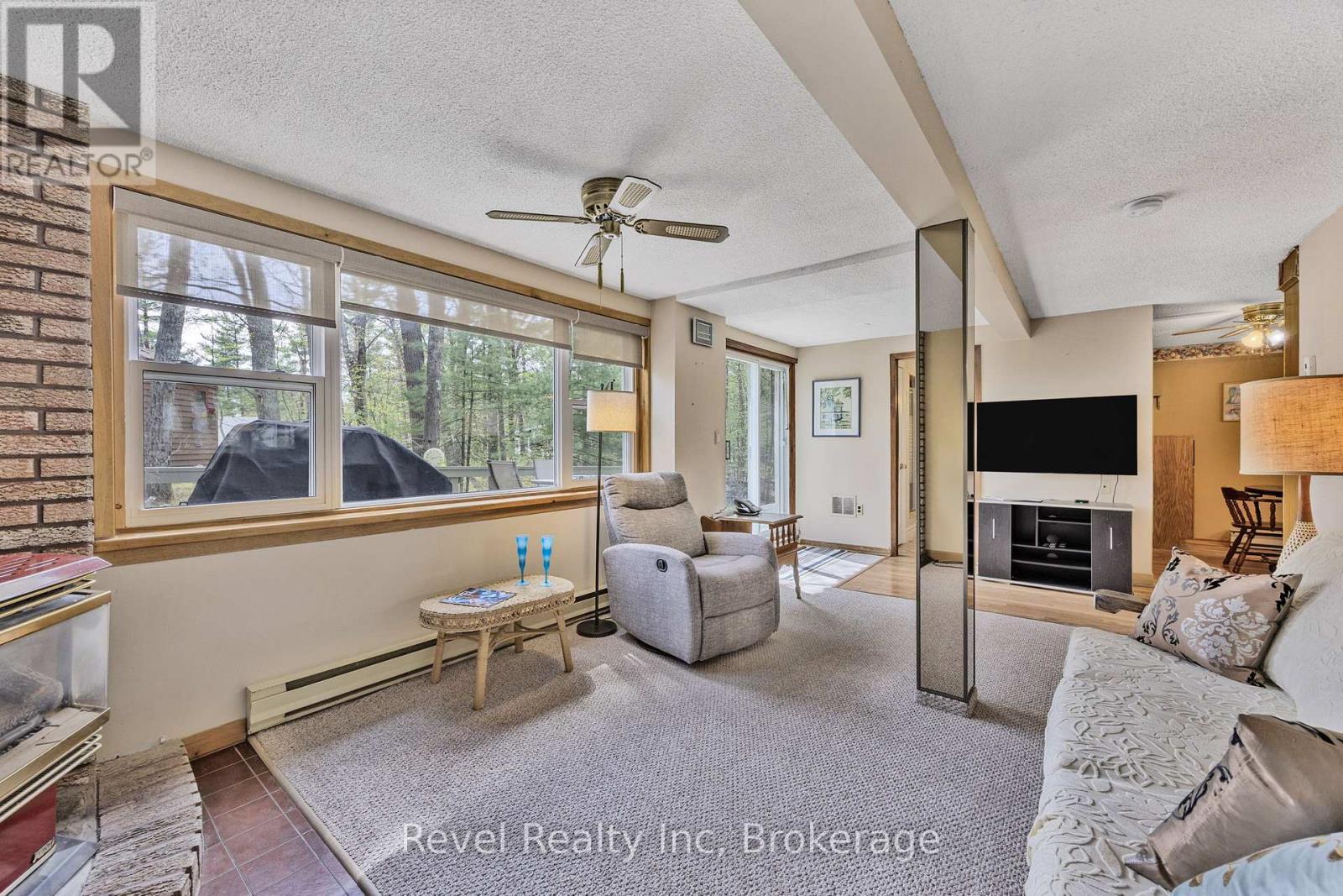 31 Desroches Trail, Tiny, ON - Indoor Photo Showing Living Room With Fireplace